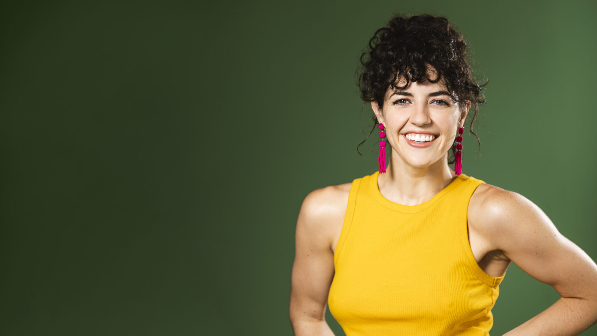 A professional realtor headshot of a smiling woman with dark hair